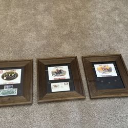 framed vintage cigar label prints paired with U.S. commemorative stamps and coins