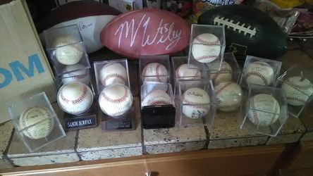 Lot of autographed baseball all the greats and USC Heisman Trophy winner autographed football