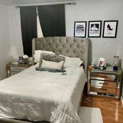 Beautiful gray upholstered bed with two large mirrored nightstands included.