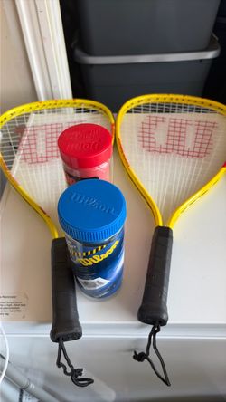 2 Racquetball  rackets and 2 tubs of balls