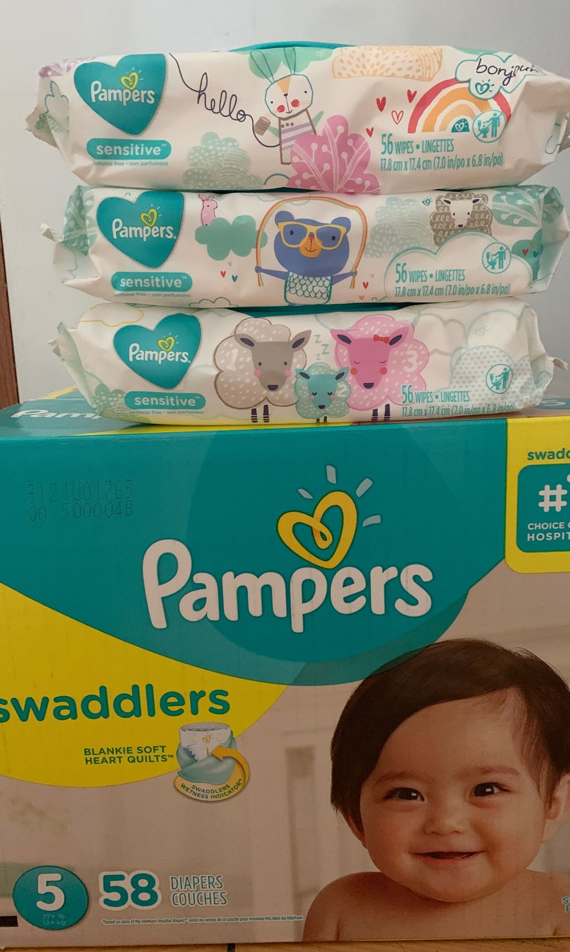 Pampers Swaddlers size 5 with 58 diapers and 3 wipes for $25
