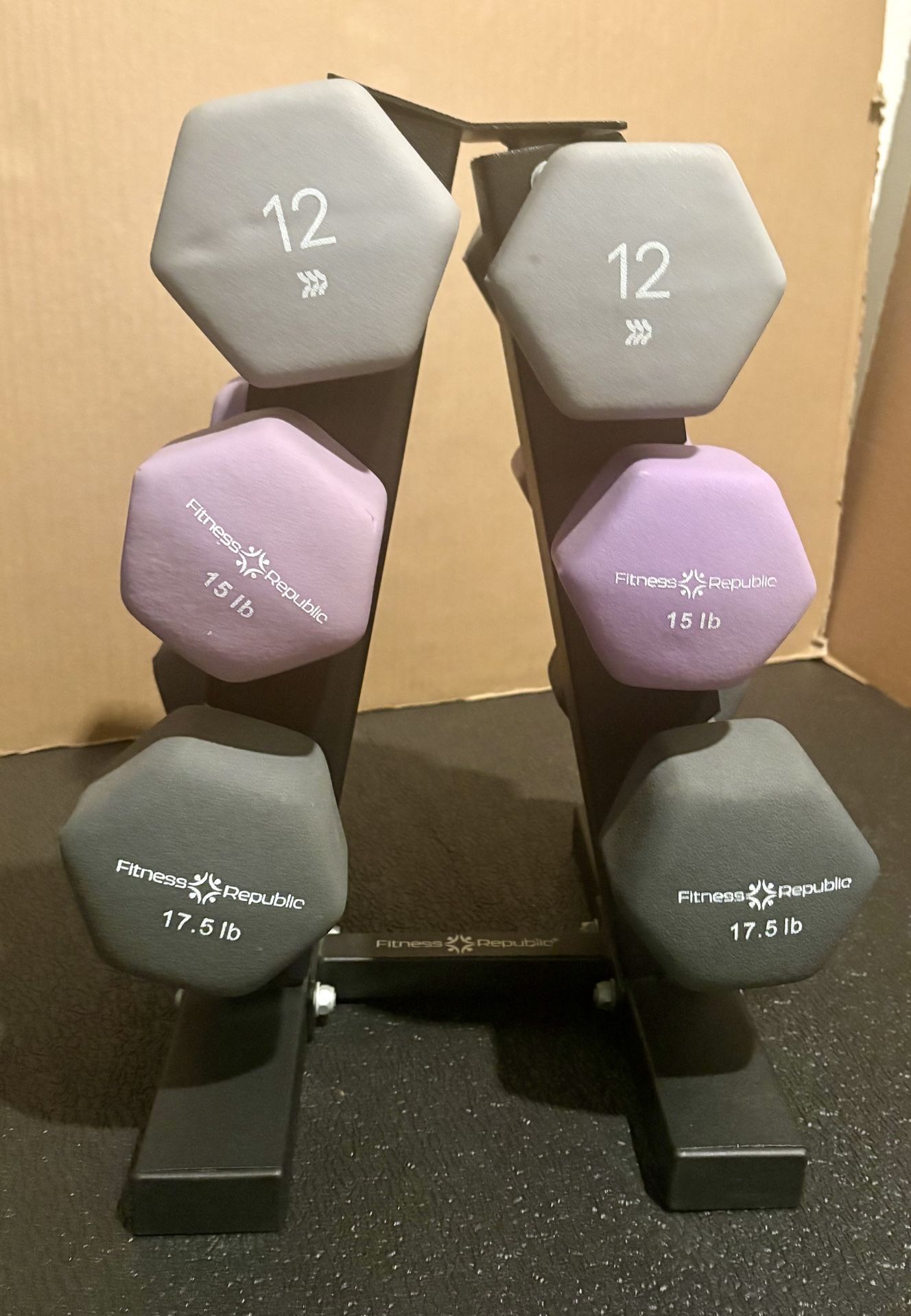 Cast Iron Neoprene Coat ...Set of Dumbbells with Rack; pairs of  12s, 15s and 17.5 lbs.