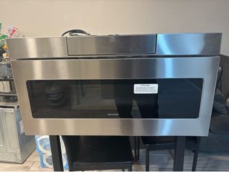Microwave drawer 30 inch sharp works perfect in good condition. Free delivery to your garage.