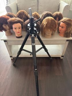 Cosmetology haircutting practice heads and tripod