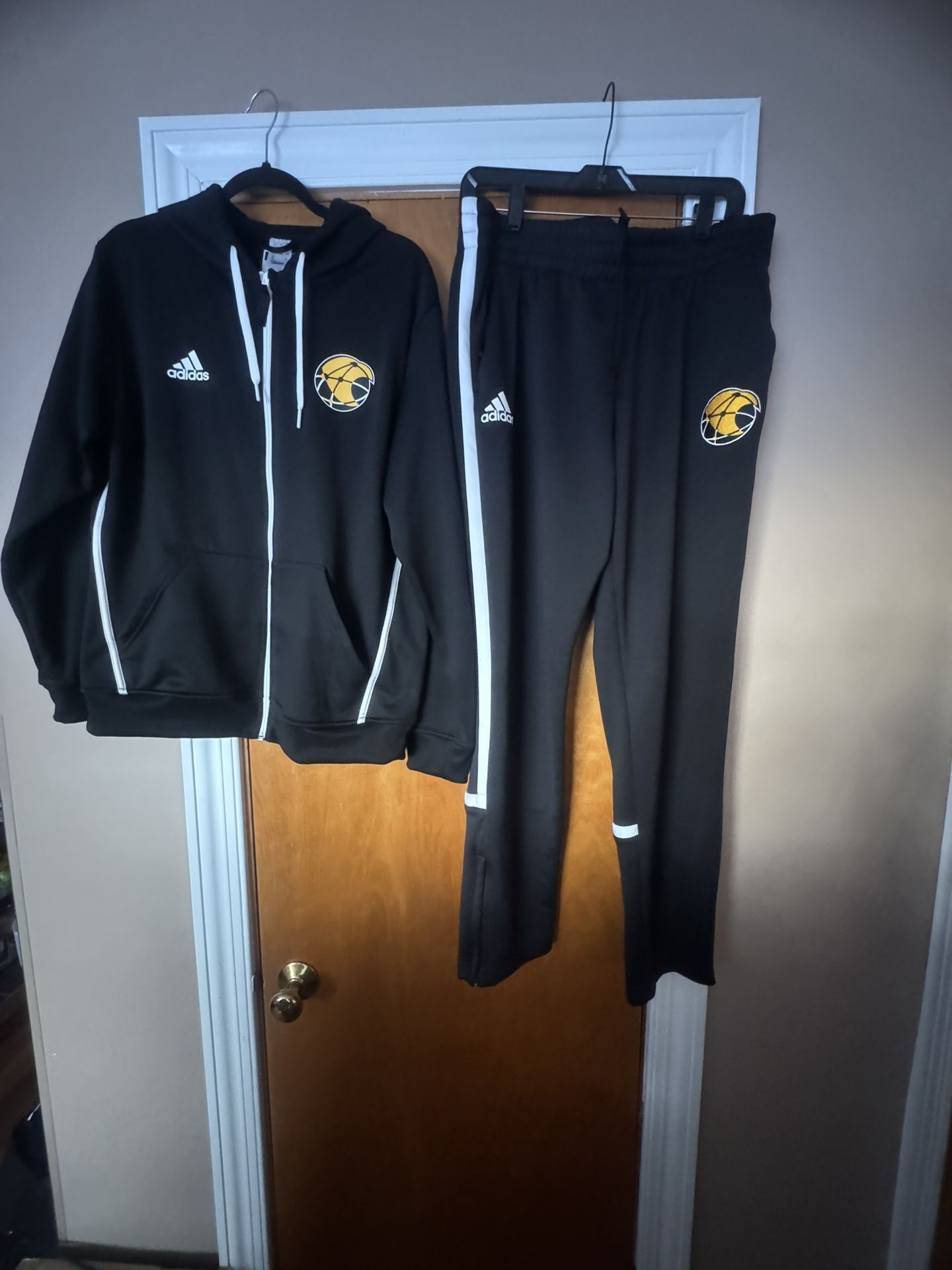 Adidas Men, Women unisex jogging suit for sale.