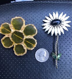 Two vintage flower brooches