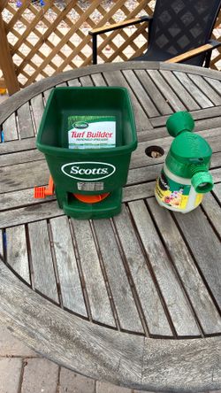 Handheld spreader and garden feeder