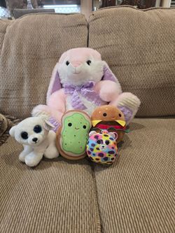 Aurora, Hug Fun, Squishmallows, and Ty's. Aurora is $2, Squishmallows are $2 each, Ty's are $2 each and the Hug Fun is $9.
