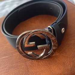 Navy blue belt with silver buckle. measure 36.