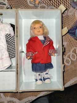Cute Little Doll With 3 Sets Of Clothing