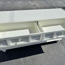 White 6-drawer dresser with woven/rattan details.