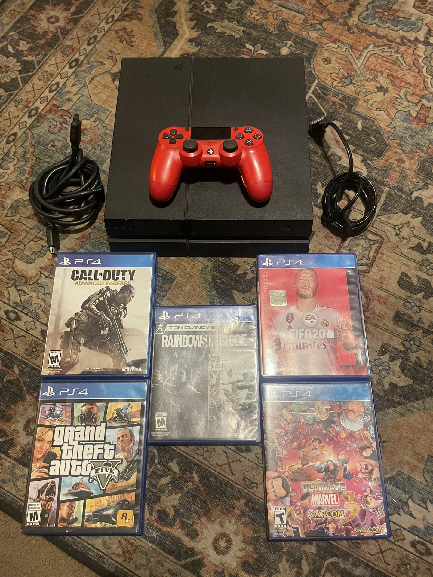 PS4 with games controller and cords.