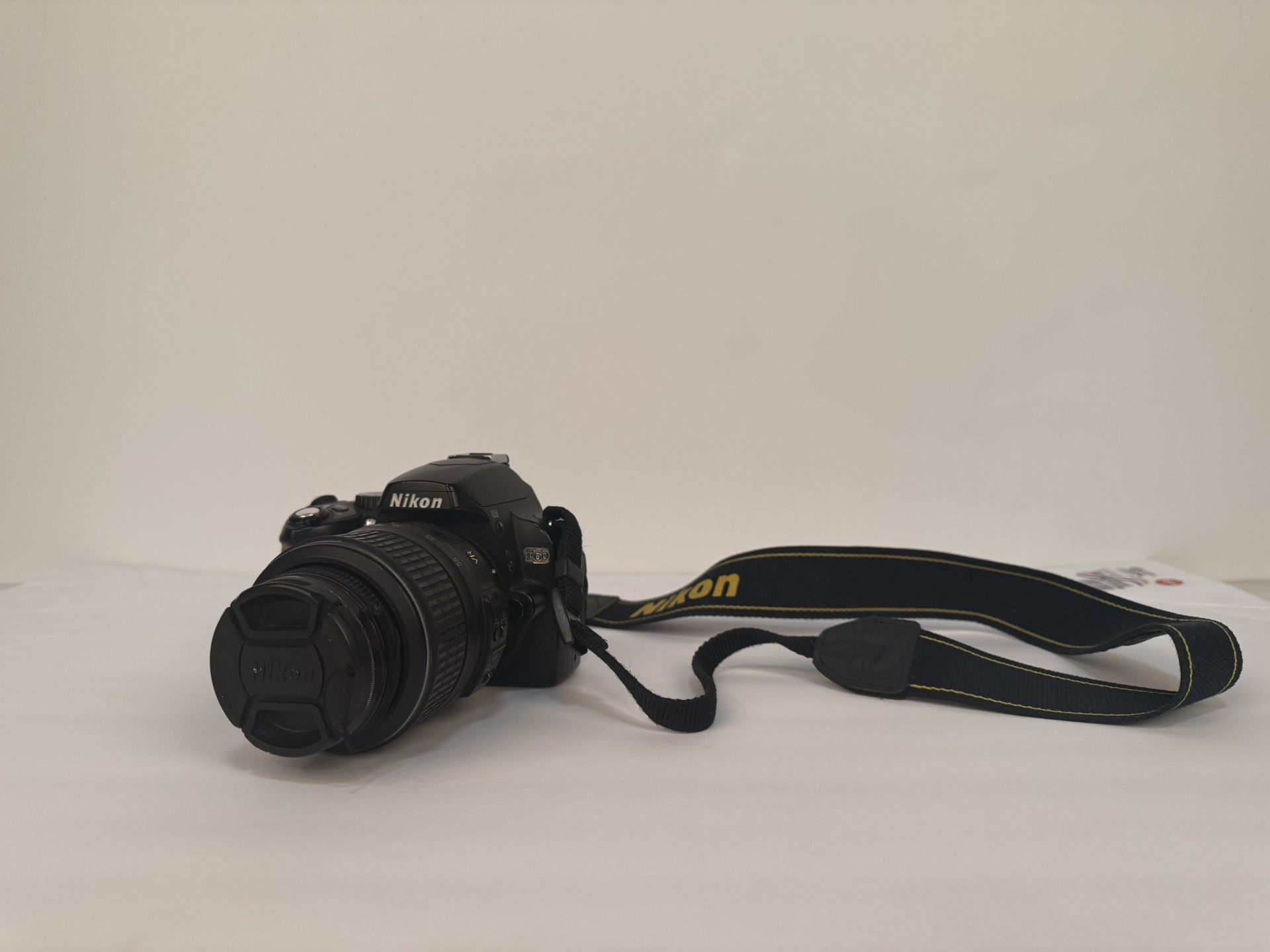 Nikon D60 DSLR Camera with 18-55mm f/3.5-5.6G Auto Focus-S Nikkor Zoom Lens + Grip+ Battery charger