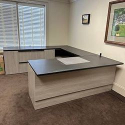 Executive Office Set Up. Large height adjustable desk. Task chair. Side chairs. Table.