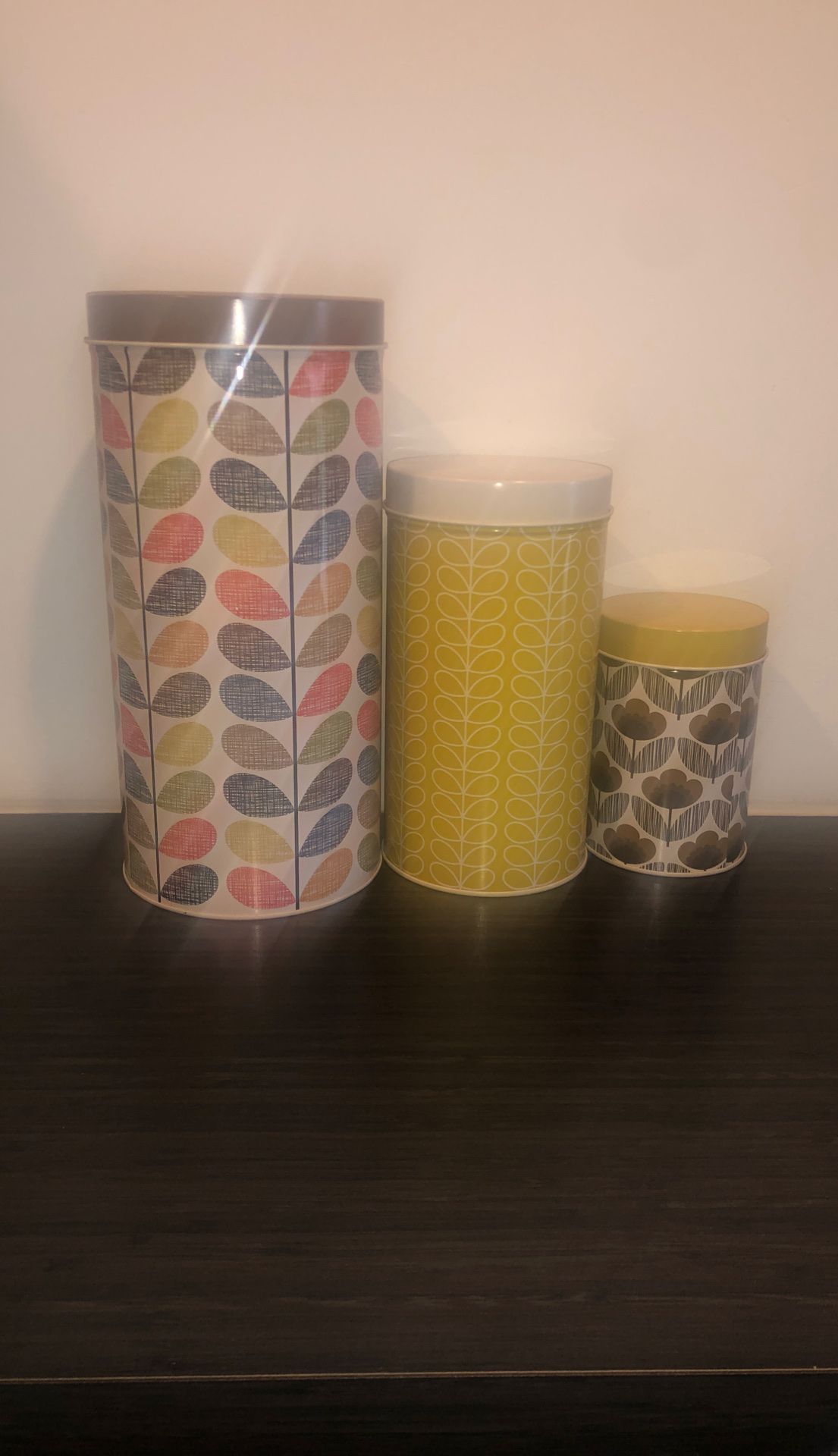 Metal tins with lids, colorful. From The Container Store.