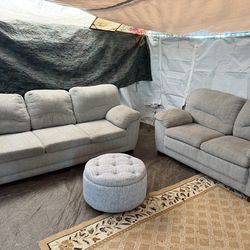 Grey couch and loveseat with storage ottoman technician clean out all the time delivery $40 local