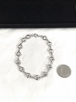 One of a kind 7-1/2” .925 silver heart shaped link bracelet