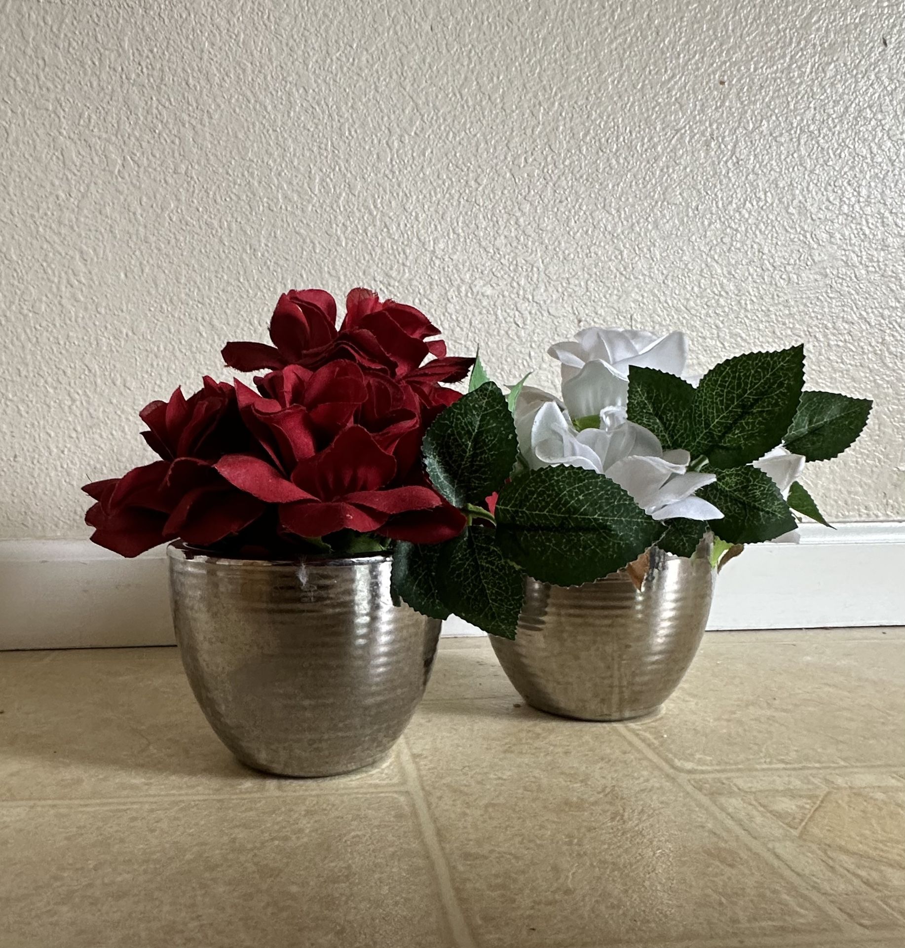 2 silver round vases