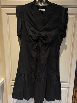 Steve Madden Amanda Minidress in Black, a 100% cotton cap-sleeve mini dress featuring a V-neckline, tie-front bodice a tiered ruffle hem