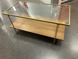 Coffee table - glass top with gold frame and wood shelf