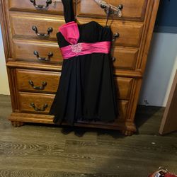 one strapped short ruffled bottom black dress with pink strap in the middle
