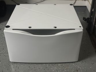 laundry pedestal include storage drawer for laundry supplies. 