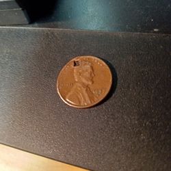1957d Penny Small Square Cut Out You Can See Letters In The Hole.