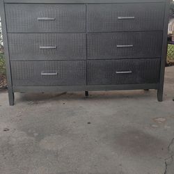 Silver/gray dresser and nightstand; purple TV stand