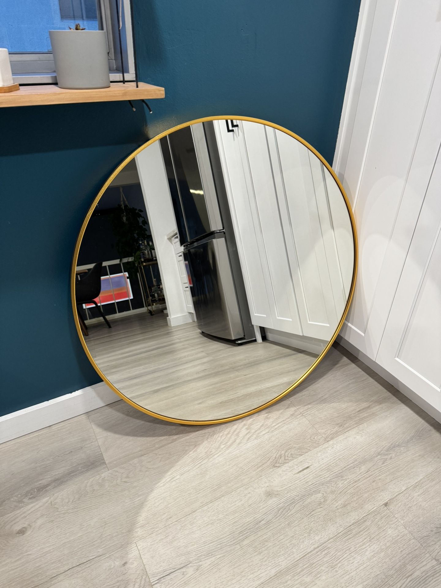 Gold Mirror and Light Fixture