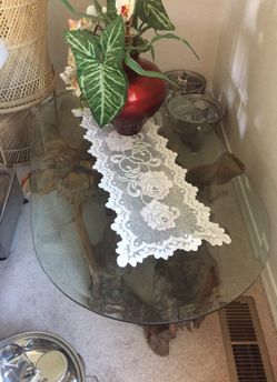 Glass table on carved wooden branches