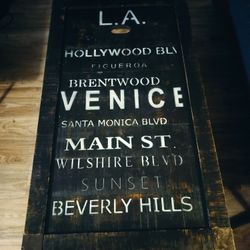 Graffiti Wood Top with Metal Legs Cocktail Table