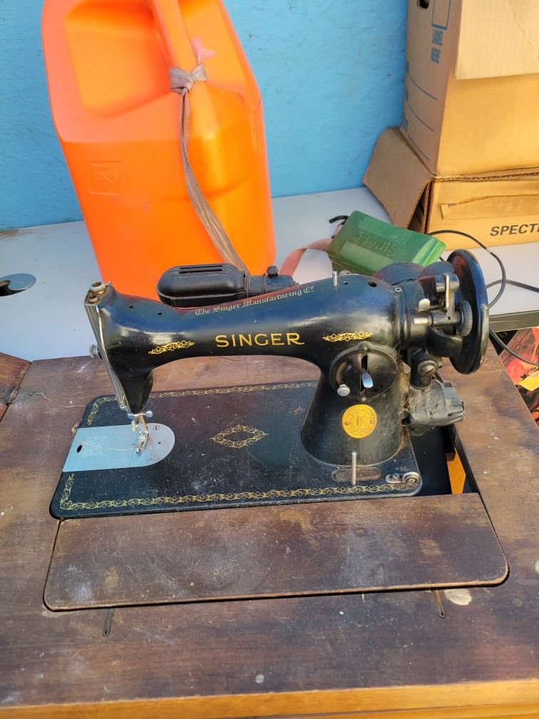 1949 Singer sewing machine with cabinet. With Cabinet And Accessories