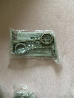 Open package  curtain rod support