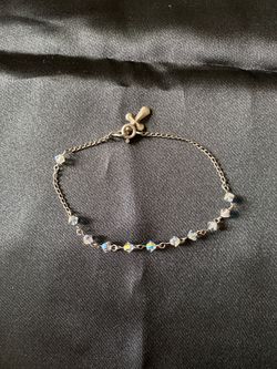 Silver bracelet with crystal stones and cross
