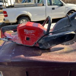 Milwaukee Fuel 9”cutoff Saw Comes With Concrete Blade And Metal Cut Off Blade Also Has Water Hookup Adapter For When You Cut Cement Inside