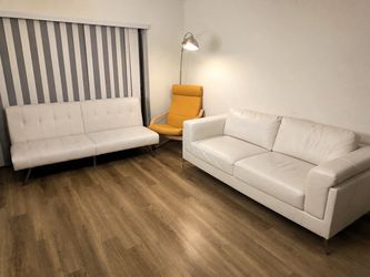 Both couches and yellow chair