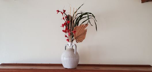 Vase with artificial flowers
