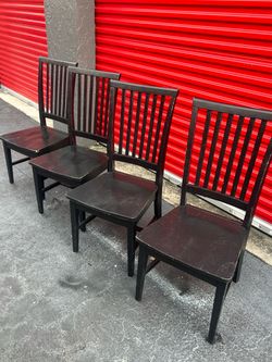 Solid wood dining kitchen set of table and four chairs . Check all pictures