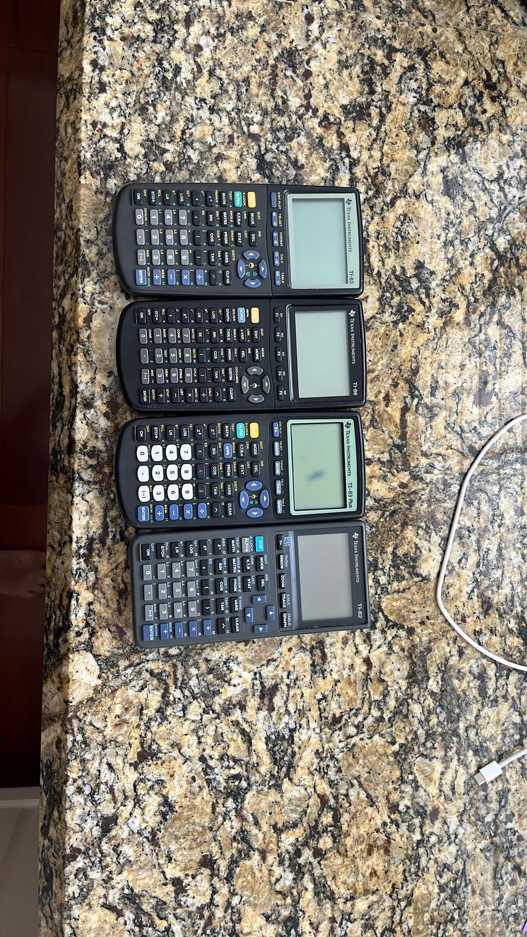 (2) TI-83, TI-86, TI-82 Graphing calculators