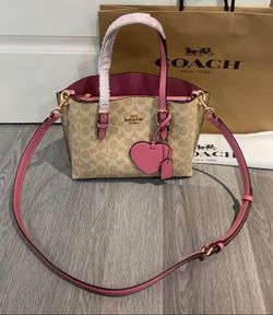 Khaki and tan Coach bag
