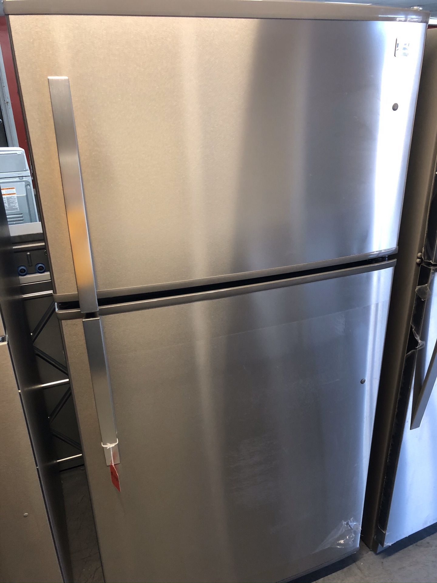 New scratch and dent kenmore 20 cu ft top and bottom fridge. 1 year warranty