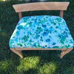 Small Chair Has Small Burnt hole In Fabric.
