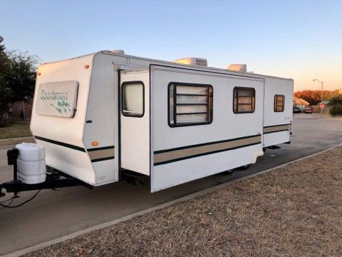 1999 Sportsmen Travel Trailer with super slide out 30 feet long