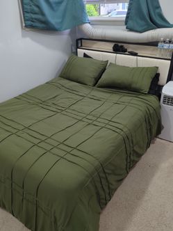 Almost brand new full size bed frame and mattress