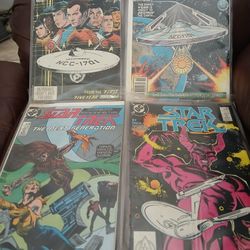 4 DC MARVEL COMIC BOOKS,  PLASTIC COVERED,  GOOD CONDITION. OBO