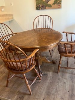 Solid oak table with four chairs