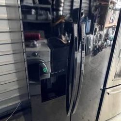 Black Kenmore Refrigerator  Side By Side With Water And Ice Dispenser