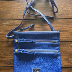 Blue leather tri zip registered Dooney and Bourke purse.