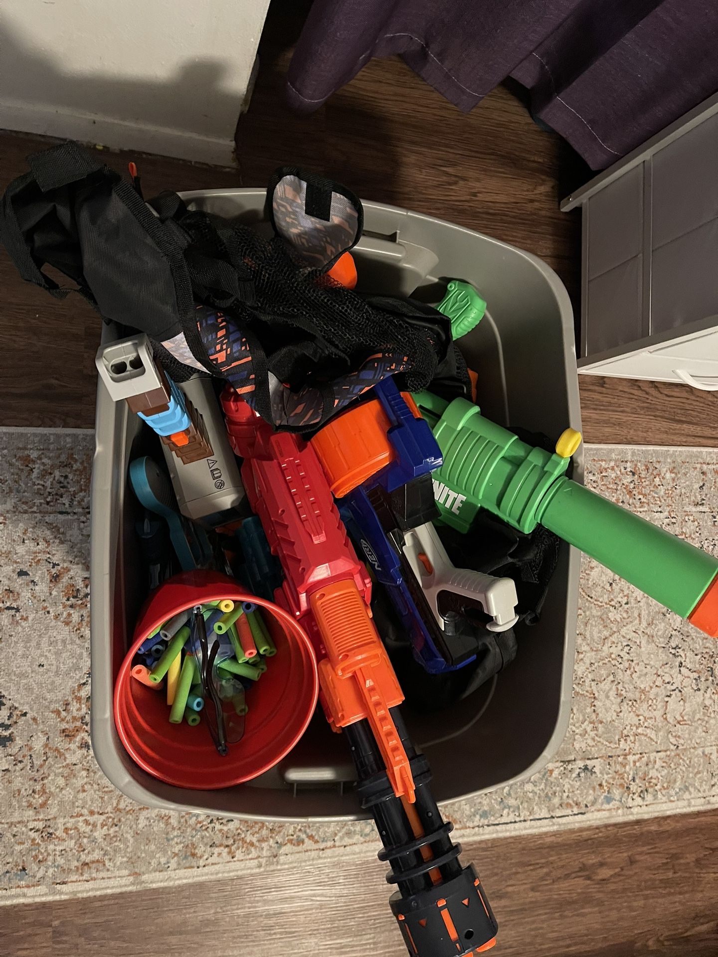 $10 Bin Of Nerf Guns, Weapons, Darts, Eyewear, Tactical Vests, Etc.