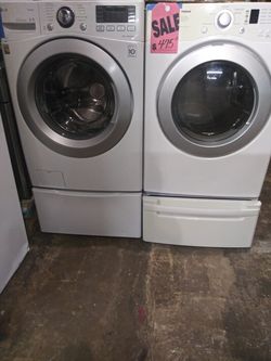 LG front load washer and dryer set with pedestals in excellent conditions